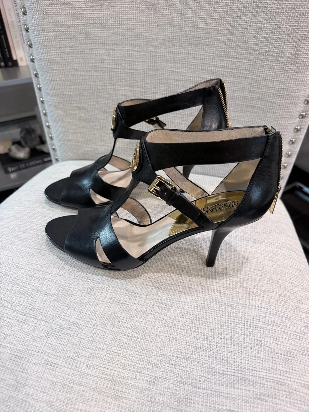 Michael Kors Black Leather Strappy T‑Heel Sandals with Gold Accents